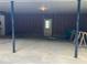 A large garage with open space, support beams, and a rear entry door at 215 N Etowah Ct, Canton, GA 30114