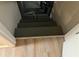 Basement stairway with metal railing and wood floors at 215 N Etowah Ct, Canton, GA 30114