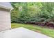 Backyard with concrete patio and landscaping at 3314 Dilmus Dr, Powder Springs, GA 30127