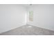Cozy room with neutral-toned carpeting and a window offering outdoor views at 3314 Dilmus Dr, Powder Springs, GA 30127