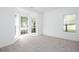 Bright bedroom with large bay windows and plush carpeting, providing ample natural light at 3314 Dilmus Dr, Powder Springs, GA 30127