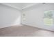 Bright bedroom with neutral carpet and white walls with natural light from two windows at 3314 Dilmus Dr, Powder Springs, GA 30127