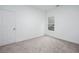 Bright bedroom with a window offering natural light and neutral carpet at 3314 Dilmus Dr, Powder Springs, GA 30127