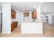 Kitchen featuring a breakfast bar, neutral countertops, and view into the living area at 3314 Dilmus Dr, Powder Springs, GA 30127