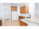 Modern kitchen with granite countertops, stainless steel sink, and light wood cabinets at 3314 Dilmus Dr, Powder Springs, GA 30127