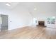 Bright living room showcasing wood floors, a fireplace, and vaulted ceilings at 3314 Dilmus Dr, Powder Springs, GA 30127