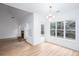 Open-concept living space with fireplace, large windows, and access to the outdoors at 3314 Dilmus Dr, Powder Springs, GA 30127