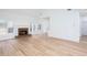 Open-concept living area with wood floors, a brick fireplace, and ample natural light at 3314 Dilmus Dr, Powder Springs, GA 30127