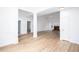 Spacious living room with wood floors, white trim, fireplace, and an open floor plan at 3314 Dilmus Dr, Powder Springs, GA 30127