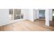 Bright living room featuring wood floors and a large window for natural light at 3314 Dilmus Dr, Powder Springs, GA 30127