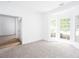 Inviting living room with hardwood flooring, large bay window, and plenty of natural light at 3314 Dilmus Dr, Powder Springs, GA 30127