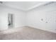 Large carpeted main bedroom with tray ceiling, ensuite bathroom, and ample natural light at 3314 Dilmus Dr, Powder Springs, GA 30127