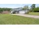 Spacious backyard featuring a two-story house with a screened in porch and garage at 100 Fairview Dr, Stockbridge, GA 30281