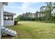 Expansive backyard with stairs leading to back door and screened-in porch at 100 Fairview Dr, Stockbridge, GA 30281