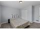 Bedroom offers grey walls, wood floors, closet and bed at 100 Fairview Dr, Stockbridge, GA 30281