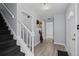 Bright entryway with hardwood floors and a staircase, creating an inviting first impression at 100 Fairview Dr, Stockbridge, GA 30281