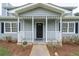 Inviting front porch with classic architectural details, providing a warm and welcoming entrance to the home at 100 Fairview Dr, Stockbridge, GA 30281