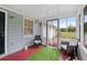 Enclosed porch with comfortable seating and views of the surroundings at 100 Fairview Dr, Stockbridge, GA 30281