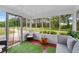 Bright sunroom with large windows, comfortable seating, and green views at 100 Fairview Dr, Stockbridge, GA 30281