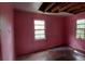 This bedroom is very pink and needs work; the room has peeling paint and damaged ceilings at 1182 Bronx Nw St, Atlanta, GA 30314