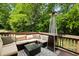 Relaxing outdoor deck with comfortable seating, a modern heater, and a beautiful natural backdrop at 2078 Marshalls Se Ln, Atlanta, GA 30316
