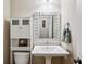 Cozy bathroom features a pedestal sink, modern fixtures, and storage at 2078 Marshalls Se Ln, Atlanta, GA 30316