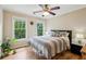 Inviting bedroom with natural light, hardwood floors, ceiling fan, and a comfortable queen size bed at 2078 Marshalls Se Ln, Atlanta, GA 30316