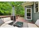 Inviting outdoor deck features a cozy seating area and stylish patio heater for year-round enjoyment at 2078 Marshalls Se Ln, Atlanta, GA 30316