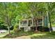 Charming home with a covered front porch, mature trees, and landscaped yard at 2078 Marshalls Se Ln, Atlanta, GA 30316