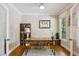 Bright home office with hardwood floors, a modern desk, and natural light streaming through the windows at 2078 Marshalls Se Ln, Atlanta, GA 30316