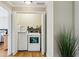 Laundry room with front loading machines and bright light at 2078 Marshalls Se Ln, Atlanta, GA 30316