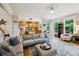 Open concept living room and kitchen area with ample seating and natural light at 2078 Marshalls Se Ln, Atlanta, GA 30316