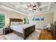 Serene main bedroom with a tray ceiling, hardwood floors, and neutral decor at 2078 Marshalls Se Ln, Atlanta, GA 30316