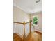 Well-lit staircase with hardwood floors and a white railing, providing natural light at 2078 Marshalls Se Ln, Atlanta, GA 30316