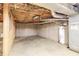 Unfinished basement with concrete floor and exposed utilities at 4953 Mcpherson Ne Dr, Roswell, GA 30075