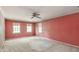 Bedroom with neutral carpet, three windows and ample space at 4953 Mcpherson Ne Dr, Roswell, GA 30075