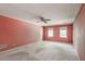 Spacious bedroom with a ceiling fan and two windows providing natural light at 4953 Mcpherson Ne Dr, Roswell, GA 30075