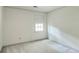 Neutral bedroom with carpet and a bright window with a roller shade at 4953 Mcpherson Ne Dr, Roswell, GA 30075