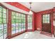 Bright breakfast nook with large windows offering scenic views and door to the exterior at 4953 Mcpherson Ne Dr, Roswell, GA 30075