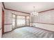 Dining room features decorative wallpaper, chair rail, and bay window at 4953 Mcpherson Ne Dr, Roswell, GA 30075
