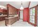 Open kitchen area with a center island, wood cabinetry, and a bright window at 4953 Mcpherson Ne Dr, Roswell, GA 30075