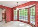 Sunny breakfast nook with bay windows, bright wallpaper, and tile flooring at 4953 Mcpherson Ne Dr, Roswell, GA 30075