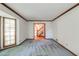 Bright living room boasts a large window, neutral walls, and wood trim at 4953 Mcpherson Ne Dr, Roswell, GA 30075
