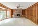 Inviting living room with large windows, a fireplace, and built-in bookshelves at 4953 Mcpherson Ne Dr, Roswell, GA 30075