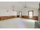 Bright living room with vaulted ceiling, fireplace, wainscotting, and multiple windows at 4953 Mcpherson Ne Dr, Roswell, GA 30075