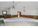 Open living room featuring high ceilings, a bar area, and fireplace at 4953 Mcpherson Ne Dr, Roswell, GA 30075