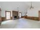 Expansive living room showcasing fireplace, bar, and multiple windows for natural light at 4953 Mcpherson Ne Dr, Roswell, GA 30075