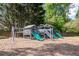 Community playground area features a large play structure with slides and swings at 4953 Mcpherson Ne Dr, Roswell, GA 30075