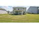 Expansive backyard featuring a well-maintained lawn, patio area, and play set, perfect for outdoor activities at 7455 Easton Valley Ln, Cumming, GA 30028