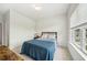 A comfortable bedroom with carpet flooring, providing a relaxing retreat with natural light at 7455 Easton Valley Ln, Cumming, GA 30028